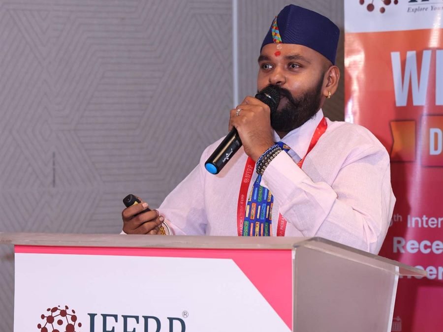 Session chair addressing the delegates from the IFERP podium