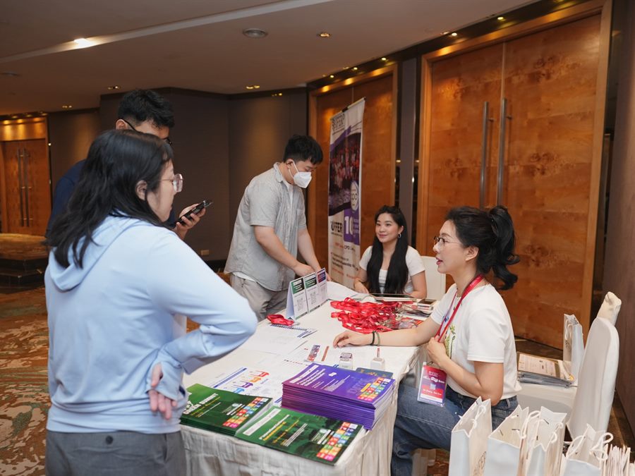 Delegates at the conference help desk