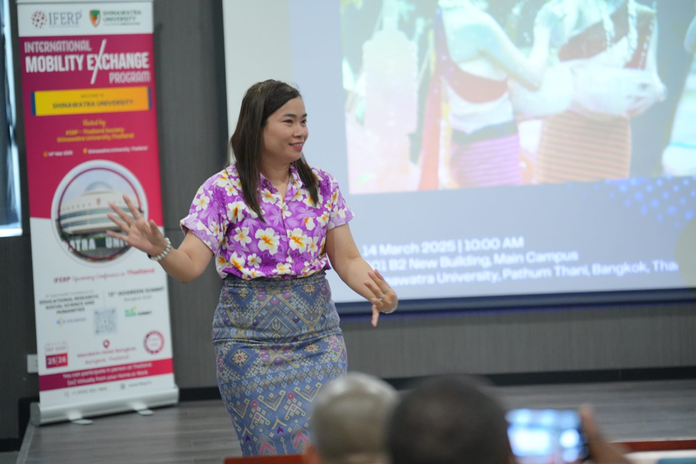 Speaker presenting to delegates at an IFERP conference